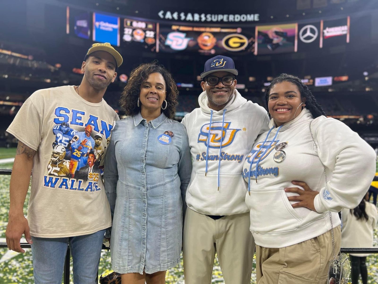 Left to right: Abraham Wallace, Venio Wallace, Coach Sean Wallace and Sadijah Wallace, in #SeanStrong shirts at the Caesars Superdome.
